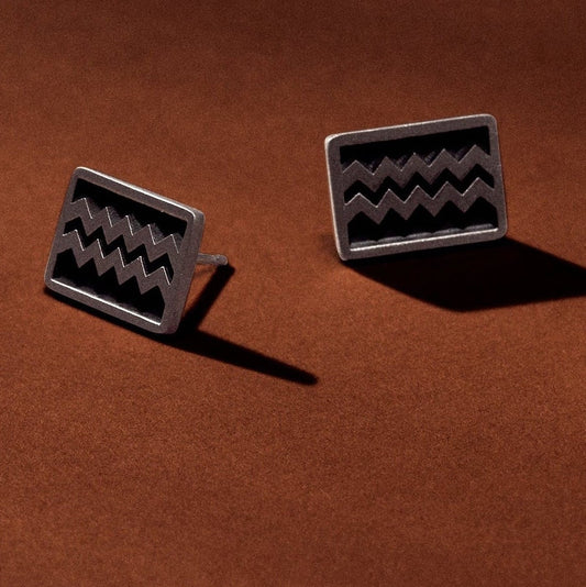 Sterling silver earrings, rectangular with zigzag engraving and satin finish with oxidation.